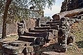 Bakong temple - guarding lions of the ancillary tower.